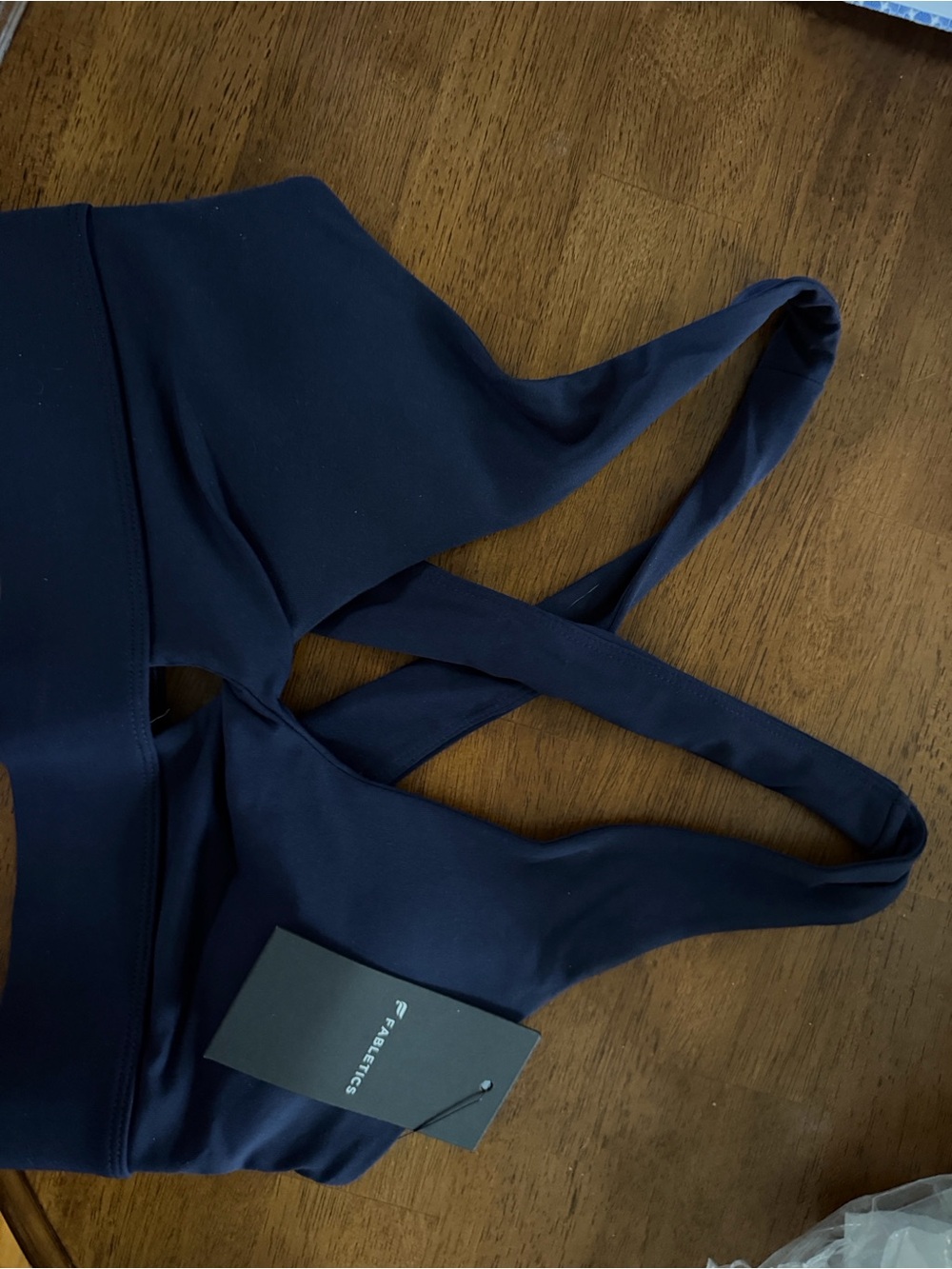 Fabletics Oasis Twist Cross-Back Sports Bra in Navy size small